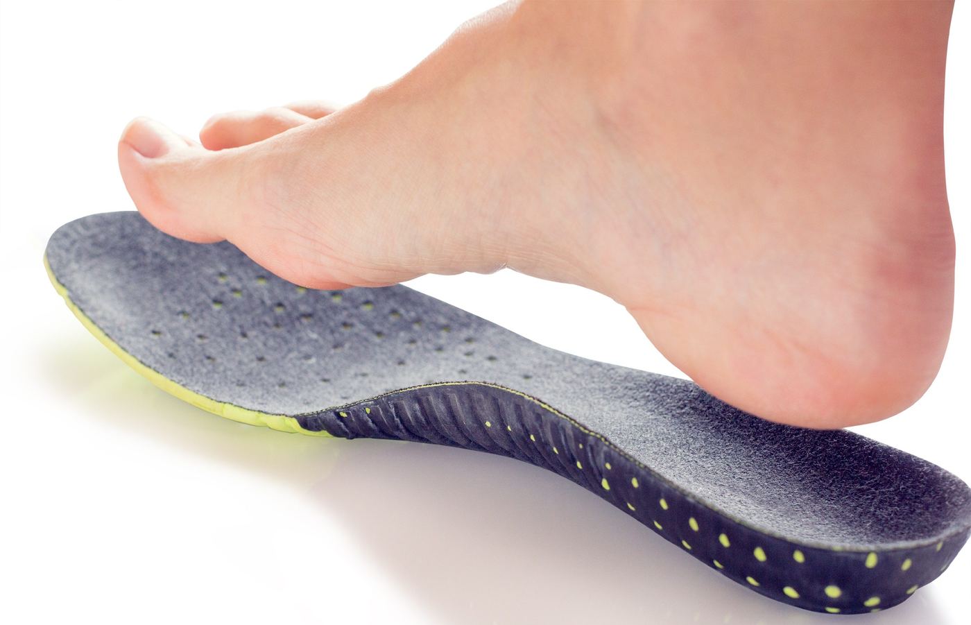 A foot resting on a custom orthotic insole